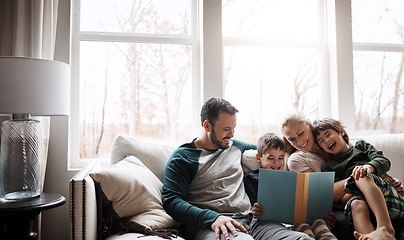 Image showing Books, reading and couple with children on couch for storytelling time in living room of happy home. Love, learning and growth, woman and man with kids, book and fantasy story smile on sofa together.