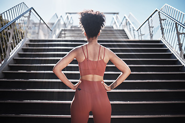 Image showing Fitness, woman and stairs for sport in city for running, exercise or healthy cardio preparation. Back of African American female ready for training, workout or sports run for wellness by staircase