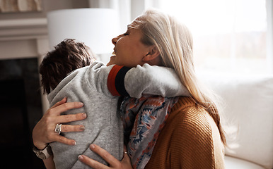 Image showing Mother, sofa and boy child with hug, love and comfort in happy care in home living room. Happy family together, couch and kid with mama, embrace and smile for support, bonding and happiness in Madrid