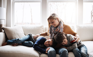 Image showing Happy family, mother bonding with children and relax on sofa for love, care and smile at home together. People, mom and kids lying on couch in the living room for cozy winter hug or fun with parent