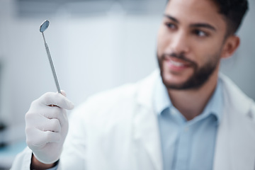 Image showing Oral care, dental and mirror in the hand of a dentist man ready for an examination or checkup for hygiene. Doctor, hands and medical with a male orthodontist working in the healthcare sector