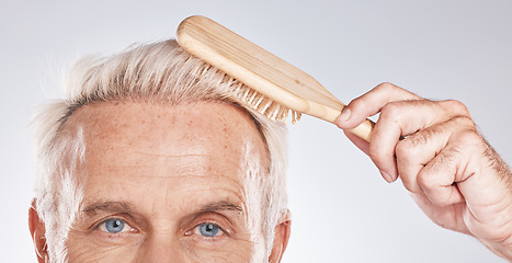 Image showing Face, man brush and hair care on studio background with beauty, barbershop salon and cosmetics. Closeup portrait of male model with comb, hairstyle and scalp product, healthy shampoo and skincare