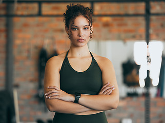 Image showing Fitness portrait, exercise and serious woman at gym for a workout, training and body motivation at health club. Face of sports or athlete female focus on performance, progress and healthy lifestyle