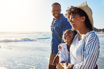 Image showing Family, travel and walking on a beach with adorable child on vacation or holiday at the ocean or sea. Summer, mother and father with black kid or daughter holding hands together near water