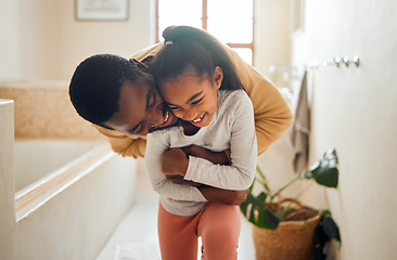 Image showing Black family, father and child for a hug in happy home with love, care and support in bathroom. Man and girl kid together for happiness with smile, energy and embrace for safety, health and wellness