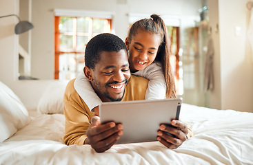 Image showing Black family, tablet or learning with a father and daughter lying together on a bed in their home for education. Relax, internet and kids with a man and girl in a bedroom for growth or development