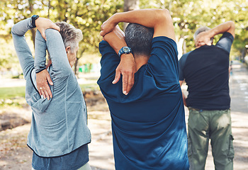 Image showing Fitness, nature and senior people doing stretching exercise before cardio training in a park. Health, wellness and active group of elderly friends in retirement doing arm warm up for outdoor workout.