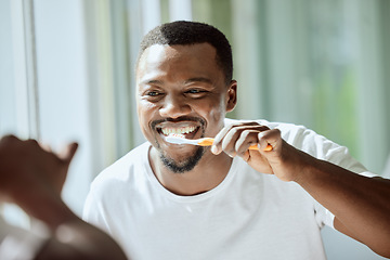 Image showing Morning, black man and dental brush wellness for health, hygiene and clean smile in mirror. Self care, cleaning and oral hygiene for healthy teeth of person smiling with confidence in home.