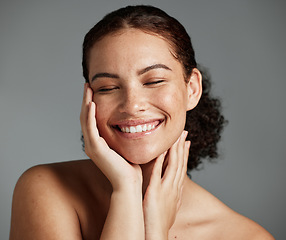 Image showing Face, beauty and satisfaction with a model black woman in studio on a gray background to promote natural skincare. Facial, wellness and makeup with an attractive young female happy with cosmetics