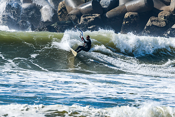 Image showing Kitesurfer riding ocean waves