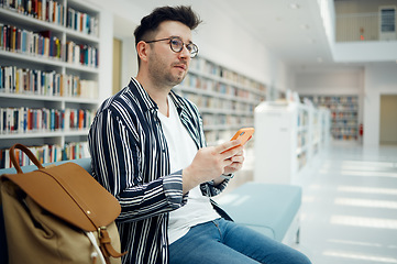 Image showing Smartphone, library and student with university idea, knowledge or mindset for education, college or research with wifi services. Campus, bookshelf and man relax, thinking with cellphone and backpack