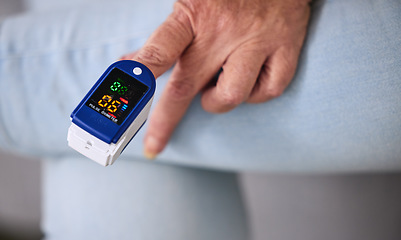 Image showing Medical, heart rate and woman with a pulse oximeter in a retirement home during consultation. Healthcare, treatment and senior female patient measuring her oxygen blood levels with health device.