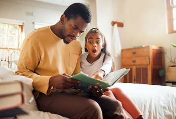 Image showing Father, child and book in shock on bed for story time, reading or learning literature sitting at home. Dad and daughter surprised or shocked in frightened expression holding textbook in bedroom