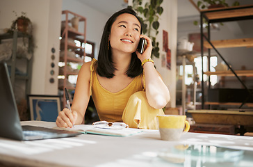 Image showing Notebook, creative startup and Asian woman on a phone call for planning, conversation and talking to client. Communication, networking and girl with smartphone, laptop and ideas for art business