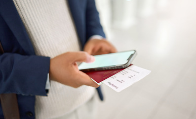 Image showing Hands, phone and passport chatting, typing or texting on mobile app or checking flight times at the airport. Hand of business employee holding smartphone and ID documents for travel, trip or journey