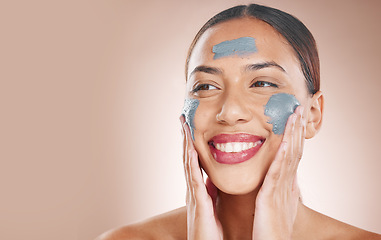 Image showing Skincare, beauty and woman with a face mask in a studio for a cosmetic, wellness and natural routine. Cosmetics, mockup space and female model from Brazil with facial treatment by a brown background.