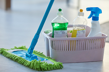 Image showing Cleaning, product and basket with mop, bottle and spray for cleaning services, wellness or chemical disinfection. Closeup of spring cleaning supplies, container and tools to dust house, floor or home