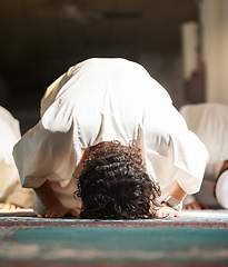 Image showing Muslim, prayer and mosque with a man praying in faith or faith for fajr, dhuhr or asr, otherwise maghrib or ishaa in a group. Salah, worship or pray with islamic men in devotion for ramadan