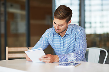 Image showing Notebook, planning and business man writing schedule, brainstorming ideas and strategy in corporate office. Vision, thinking and male entrepreneur write on paperwork, notes and documents at desk