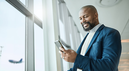 Image showing Email, travel and black man with a phone at the airport for connection, communication and work update. Happy, executive and African businessman reading information on a mobile while on a trip