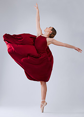 Image showing Ballet, dance and woman training for performance, wellness and hobby on grey studio background. Ballerina, creative dancer and female young person practice, routine and artist dancing, talent or free