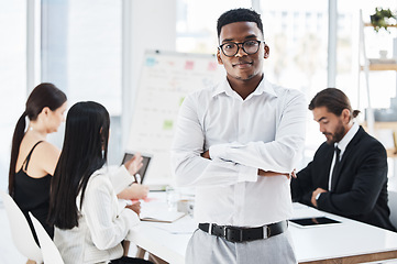 Image showing Black man, leader and portrait with business people in meeting, discussion or strategy for company vision. Businessman, arms crossed and focus in office for success, career mission or corporate goals