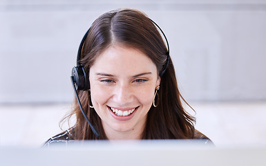 Image showing Woman, call center and smile with computer for customer service, advice and conversation while reading screen. Crm expert, consulting job or telemarketing agent with voip tech, happy and contact us