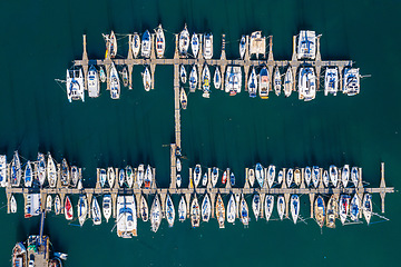 Image showing Ocean, harbor and drone of boats on the water for travel, sailing and holiday in Spain. Environment, marine and above of sea transportation at a port for vacation, cruise and traveling adventure