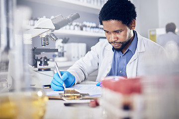 Image showing Black man writing report for science experiment, scientist in lab for research to test and study for scientific innovation. Biotechnology in laboratory, focus and knowledge, pen and checklist.