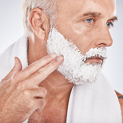 Image showing Man face, hands or grooming shaving foam in health maintenance or beauty aesthetic on gray studio background. Zoom, mature model or hair removal cream in facial cleaning, growth or hygiene skincare