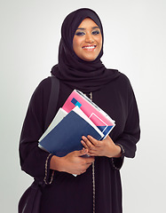 Image showing Portrait, muslim and books with a student woman in studio on a gray background for learning or education. Islam, university and study with an islamic female at college to study on a scholarship