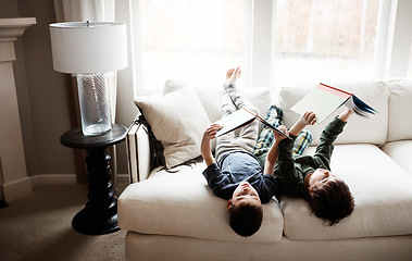 Image showing Upside down children, fun or reading books in education, learning or relax studying on house living room or sofa. Kids, storytelling or fantasy fairytale novel in creative inspiration at family home