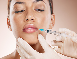 Image showing Botox, face and beauty with woman and lip filler, plastic surgery zoom and syringe needle for procedure. Hands, serum and cosmetic care for lips, facial injection treatment against studio background