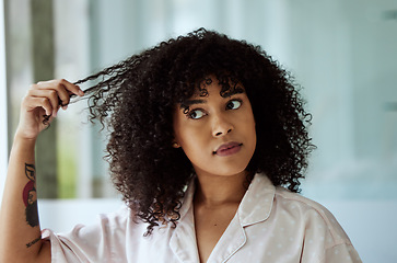 Image showing Morning, natural and black woman with hair care bathroom routine feeling curly hair texture. Beauty, self care and african girl thinking of cosmetic treatment in home with thoughtful face.