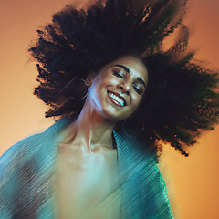 Image showing Hair movement, beauty and face of black woman with afro in studio for hair care, beauty products and wellness. Creative art, hair salon and happy female with motion for cosmetics, fashion and makeup