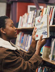 Image showing Black woman with book, student of medicine in library, pills and healthcare education with learning about pharmaceutical drugs. Reading information, learn and study, research for medical exam