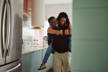 Image showing Black couple, piggyback and love while together in home kitchen with care and happiness in a marriage. Happy young man and laughing woman playing fun game while to bond in their house or apartment