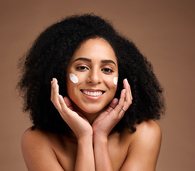 Image showing Skincare, sunscreen and black woman in portrait for facial, beauty and cosmetics promotion of product in studio. Happy African model with skin care, dermatology and cream, hands and face for wellness