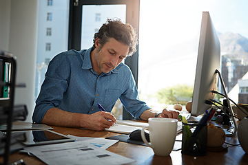 Image showing Notebook, writing and planning with a businessman working on his desk in the office for growth or development. Strategy, mindset and mission with a male employee at work to write notes in his book