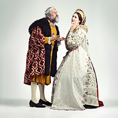 Image showing Anger, medieval and king with queen on a white background for argument, frustrated and fighting. History, theatre and royal couple in vintage, renaissance and Victorian cosplay isolated in studio