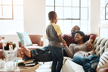 Image showing Relax happy black family child, parents or African people smile together, bonding and enjoy quality time. Happiness, love and young youth kid, easy father and mother lounge on home living room sofa