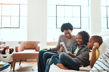 Image showing Family with tablet, watch and relax at family home together, spending quality time together with technology. Black people, mother and children on sofa with device, internet wifi and social media