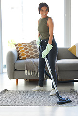 Image showing Portrait, woman and vacuum for cleaning, living room and chores for freshness, dirt and hygiene. Female, girl and cleaner with machine to remove dust, housework and wellness in lounge, carpet or home