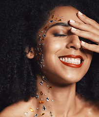 Image showing Woman, face or fashion body rhinestones on black background studio in jewels sparkle, festival diamonds or creative party crystal. Zoom, hand or happy afro beauty model, skin gem or makeup cosmetics