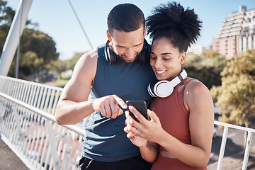 Image showing Fitness, exercise and black couple with phone in city for running, marathon training and workout on bridge. Love, sports and man and woman on smartphone for social media, music and health mobile app