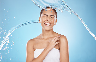 Image showing Woman skincare, laughing or water splash on blue background studio for shower healthcare wellness, Brazil hygiene maintenance or self care grooming. Happy smile, beauty model and cleaning water drop