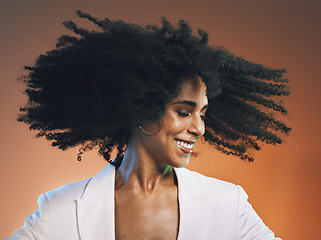 Image showing Natural hair, beauty and black woman with hair care, cosmetics and happiness against studio background. Makeup, dance and freedom with pride in curly hair texture and wellness in skincare headshot