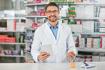 Image showing Portrait, tablet and healthcare with a pharmacist man at work in a pharmacy for pharmaceutical medication. Medicine, trust and pills with a male working in a medical dispensary for treatment or cure