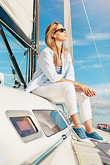 Image showing Fashion, travel and woman on yacht in ocean for holiday, summer vacation and weekend getaway in Italy. Travelling lifestyle, adventure and lady with sunglasses smile, relax and freedom on boat trip