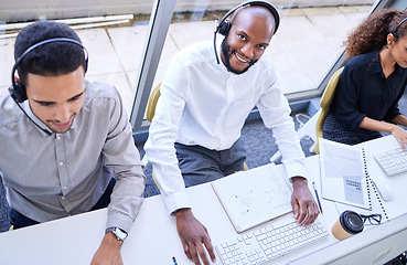 Image showing Call center, telemarketing black man and portrait with success smile, customer care excellence and solution above. Happy IT person, technical support agent or consultant people working at help desk